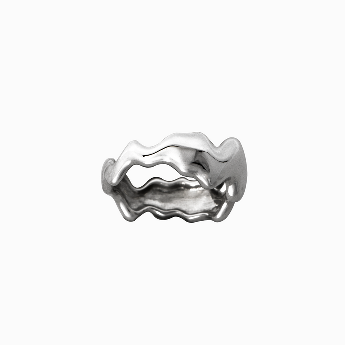 Silver ring with wavy design on a white background